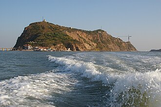 Jinzhou, China — Bijia Mountain and its tidal land bridge